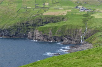 Coastal view with waterfall and Vidareidi village, Vidoy Island, Viðareiði, Viðoy Island, Faroe