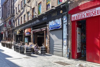 Urban scene with the Beatles Museum and outdoor cafés, Liverpool