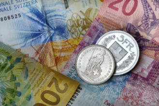 Swiss coins on banknotes, Switzerland, Europe