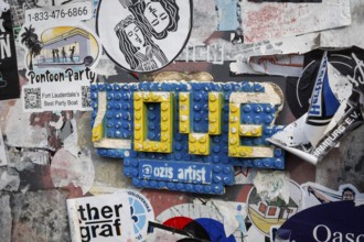 Love, written with blue and yellow Lego bricks, Nyhavn, Copenhagen, Denmark, Europe