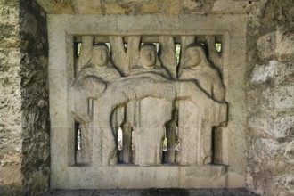 Relief in wall, 3 woman holding the dead Jesus, Mary, Christian art, garden of St John's Church,