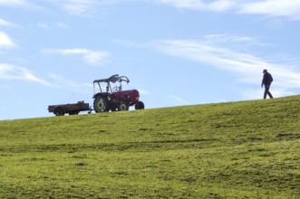 A farmer walks to an old tractor, Nesselwang, 14.10.2021