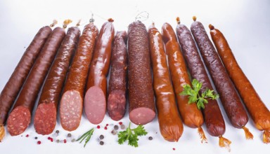 Food, meat products, various smoked sausages on a white surface AI generated, AI generated