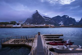 View of Sakrisoy with its typical yellow or ochre-coloured wooden houses on wooden stilts (rorbuer)