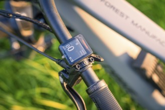 Close-up of a bicycle handlebar with display at sunset in nature, forest bike, e-bike, Calw, Black