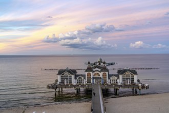 The pier of Sellin, evening mood, sunset, 394 metres long, with restaurant, jetty, beach chairs,