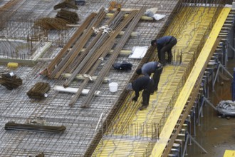 Construction site, reinforced concrete reinforcement bars, for a building ceiling, are installed