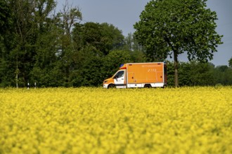 Landscape on the Lower Rhine, ambulance on the B57 federal road between Xanten and Kalkar, road