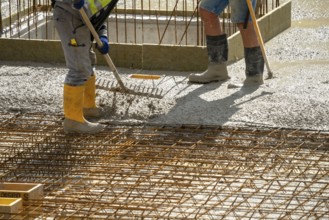 Construction site, concreting, the floor slab of a building is concreted, the concrete is pumped