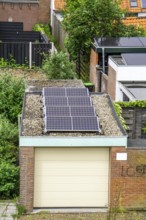 Solar modules on roofs, here on a car garage, Vlissingen, Netherlands