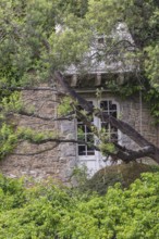 Detail of a hidden building in Pont-Aven. The village is known for the artists who worked there