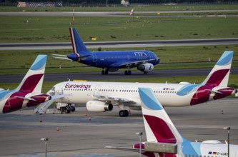 Düsseldorf Airport, ITA Airways Airbus A319-100 on the taxiway, Eurowings Airbus at outside