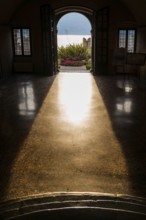 View from the inside of a city villa, light, sun, sunbeam, backlight, dramatic, architecture,