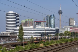 Düsseldorf city centre skyline, Medienhafen, railway tracks at Düsseldorf-Hamm stop, North