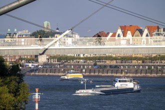 Cargo ships on the Rhine near Düsseldorf, bridge over the Media Harbour, Oberkassler Rhine Bridge,