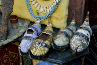 Traditional decorated babouche shoes in the medina, shop, bazaar, flea market, souk, trade,