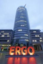 Illuminated logo in front of the headquarters of the ERGO Insurance Group, blue hour, Düsseldorf,