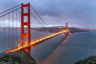 The illuminated Golden Gate Bridge in San Francisco at dusk, California, United States of America,