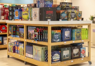 Shop display of board games inside John Lewis store, Cambridge, Cambridgeshire, England, UK