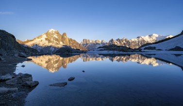 Evening mood, mountain landscape at sunset, alpenglow, water reflection in Lac Blanc, mountain