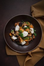 Warm Salad with crispy eggplant and tomatoes, cottage cheese, spices, herbs, sesame seeds,