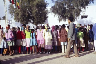 Women and girls await the arrival of the President during a visit to El Golea, now called El Menia,