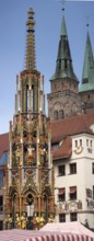 The Beautiful Fountain and behind it the towers of St Sebald's Church, Nuremberg, Middle Franconia,