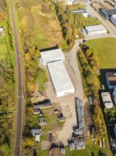 Industrial view with railway line and autumnal vegetation, refugee accommodation Beermiß, Calmbach,