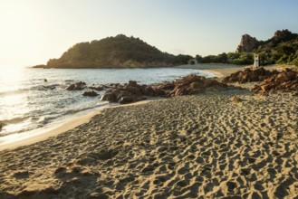 Lonely picturesque beach and red rocks, Spiaggia Su Sirboni, sunrise, near Tertenia, Province of