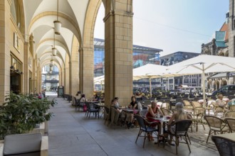 Street café in the Red Tower Gallery with seating on the market square in front of the New Town