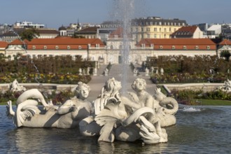 Fountain in the palace gardens and the Lower Belvedere in Vienna, Austria, Europe