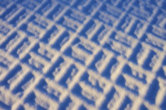 Geometric pattern in the snow in clear winter light, winter, Wasserkuppe, Gersfeld, Rhön, Hesse,