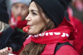 A Volkswagen employee demonstrates with whistles in front of the Volkswagen Arena during the