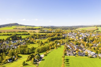 Town view of Schlettau from the air in autumn, Scheibenberg in the background, Erzgebirge, Saxony,