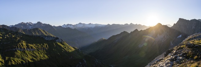 Panorama, mountain landscape at sunrise with sun star, view of mountain peaks of the Venediger