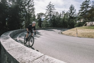 Road bike rider in spring between Lechtal and Tannheimer Tal in front of picturesque scenery of the