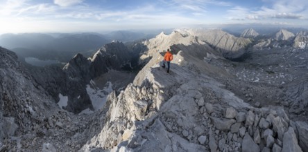 Mountaineers on a steep rocky ridge, impressive mountain landscape, view of the Höllental and the