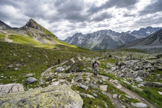 Mountaineer on a hiking trail, mountain landscape near Arolla, Valais, Western Alps Switzerland