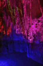 Stalactites illuminated by coloured light, stalactite cave, Höllgrotten, Baar, Canton Zug,