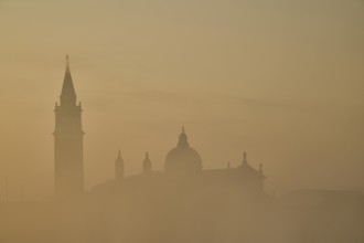 View from 'Colonna di San Marco e San Teodoro' on church 'Giorgio Maggiore' on a foggy morning at