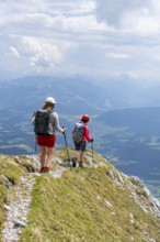 Mountaineer with helmet on a hiking trail, Wilder Kaiser, Kaiser Mountains, Tyrol, Austria, Europe