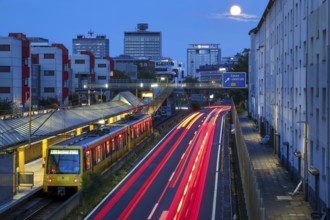 Essen, North Rhine-Westphalia, Germany, A40 motorway in the city centre at dusk. Underground line