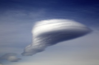 Lenticular cloud, altocumulus, lenticularis, formed over Alpujarras mountains, Almeria, Spain,