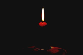 Candlestick, burning red candle