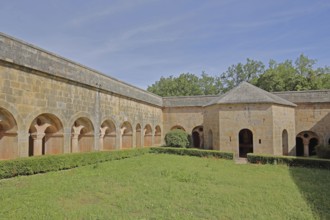 Well house with cloister and courtyard of the Romanesque abbey of Le Thoronet, monastery complex,