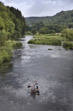 Tourists in canoe on the river Semois in the Belgian Ardennes, Belgium, Europe