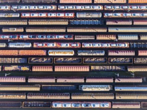 Deutsche Bahn AG marshalling yard. Many goods trains are parked on the tracks with tank wagons, car