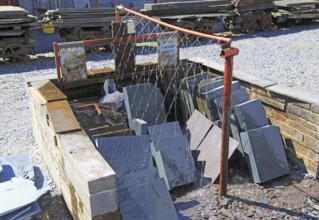 Water spraying slates, National slate museum, Llanberis, Gwynedd, Snowdonia, north Wales, UK