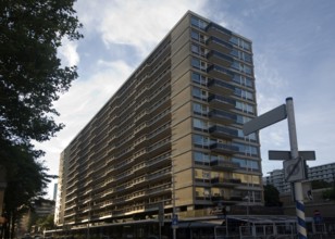 Early morning sunshine falls on modern residential apartment block central Rotterdam, Netherlands