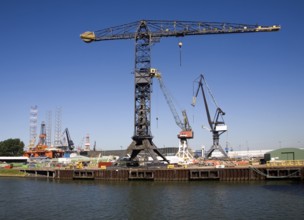 Cranes on quayside Verolme shipyard Port of Rotterdam, Netherlands